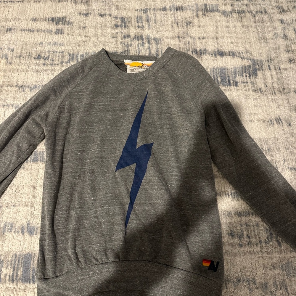 Gray Sweatshirt with Blue Lightning Bolt